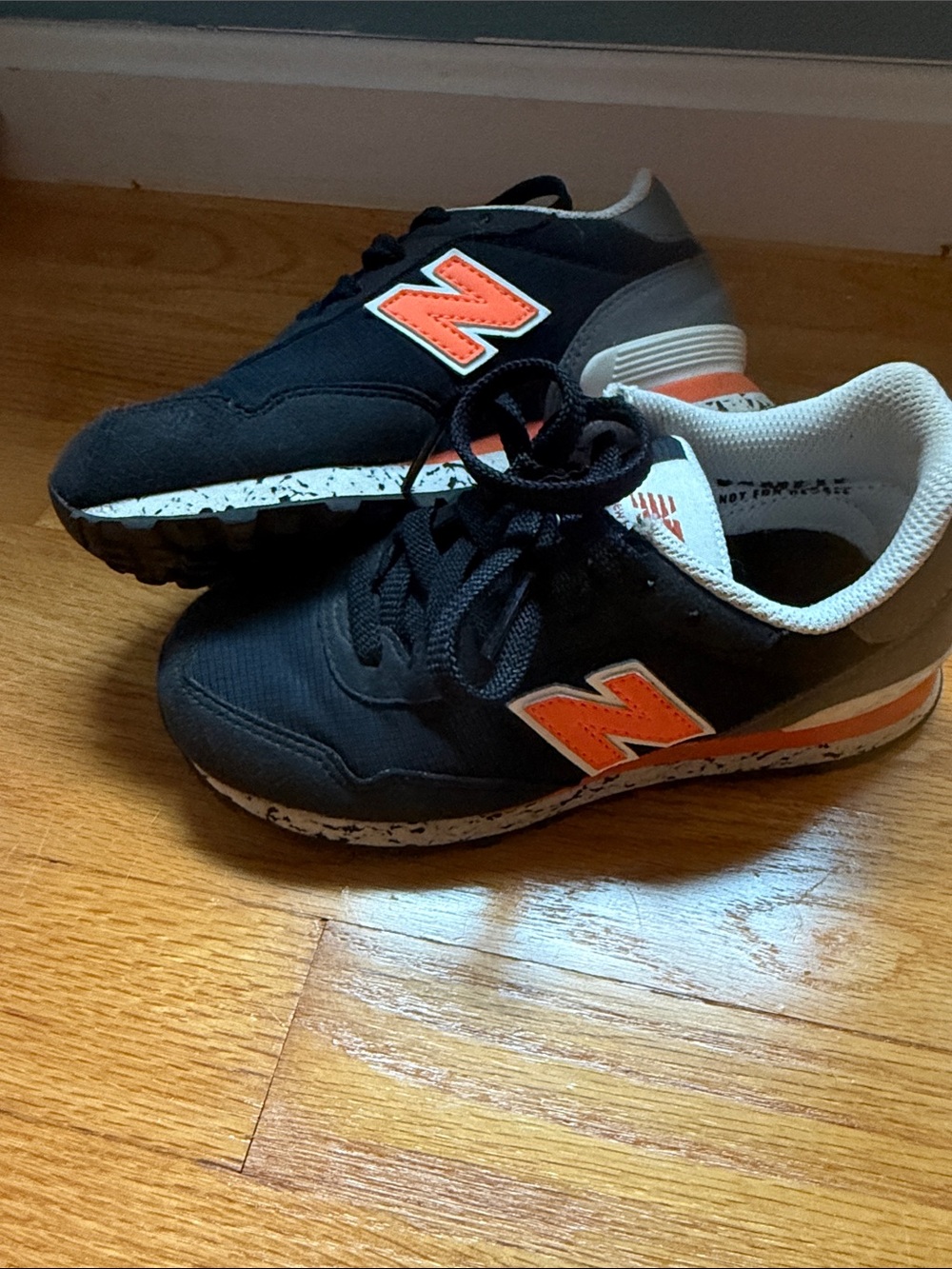 New Balance Kids Black and Orange Athletic Sneakers